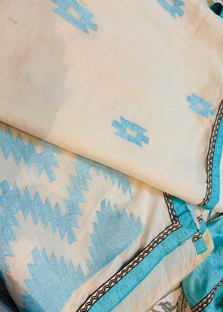 Cream Saree with Blue Embroidery blouse