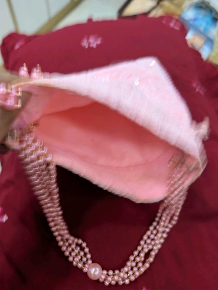 pink embroiderd party  potli bag absolutely new