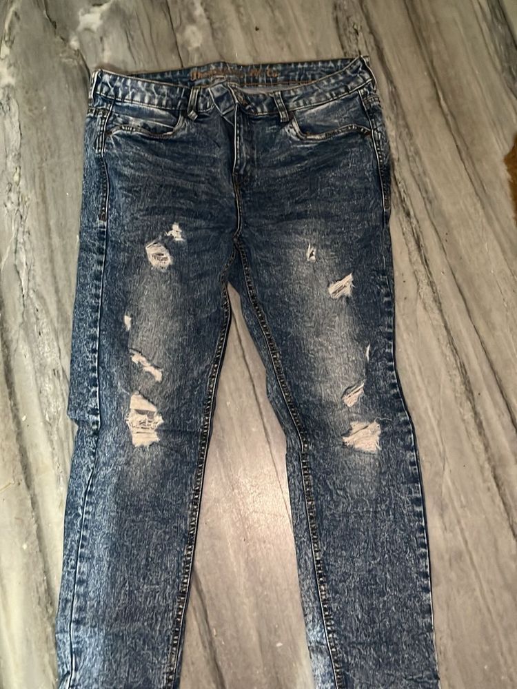 Distressed Blue Denim Jeans