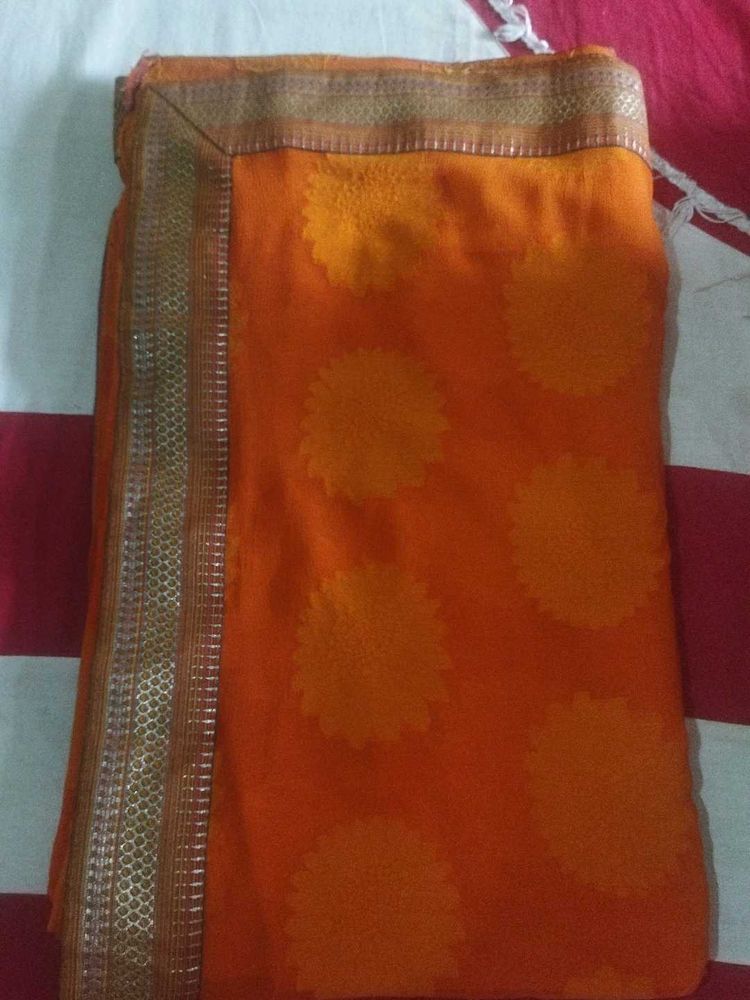 Orange Saree with Floral Motifs