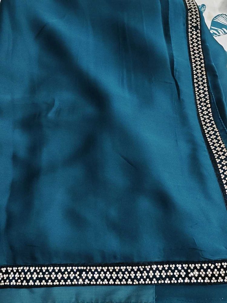 Elegant Teal Saree with Embellished Border