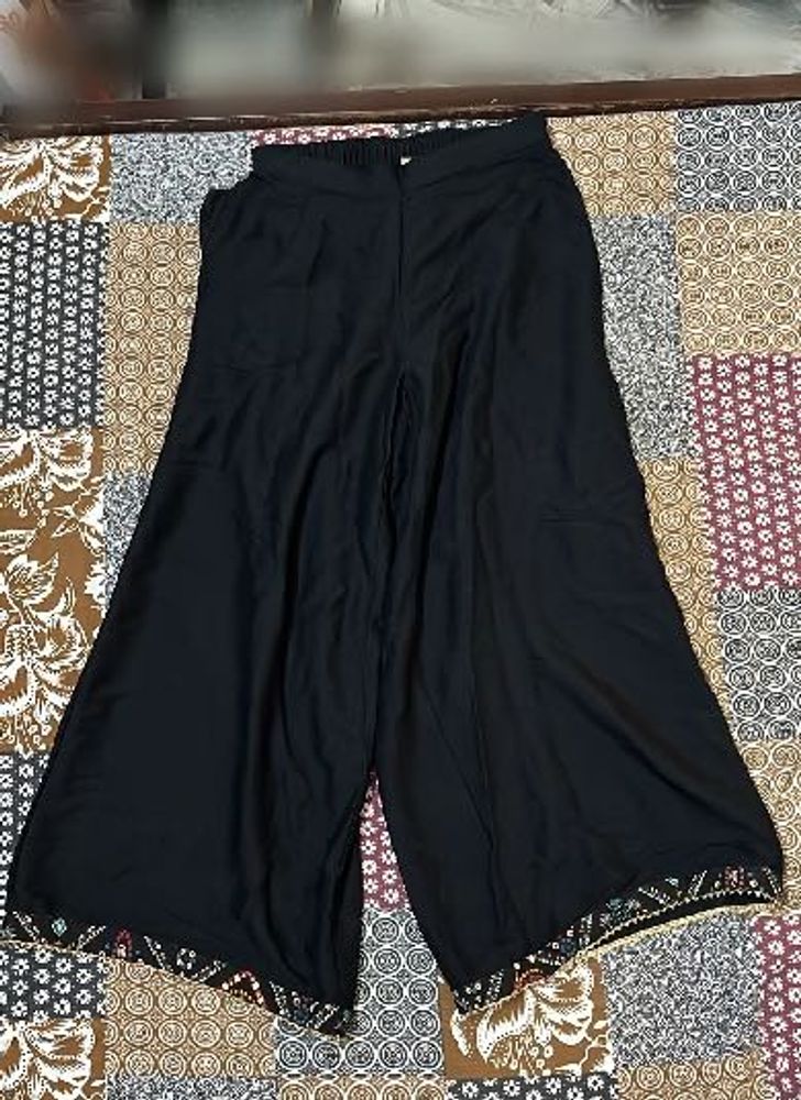 Elegant Black Palazzos with Embroidered Hem
