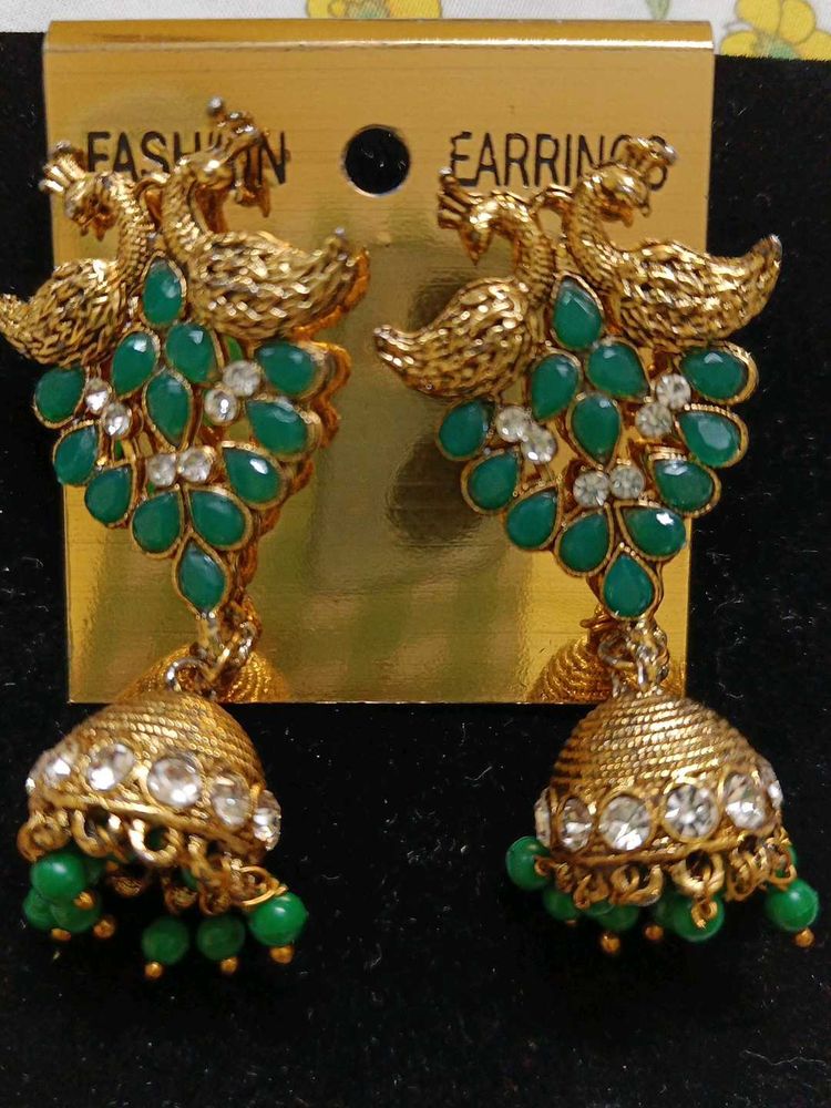 Peacock jhumka with golden bangles
