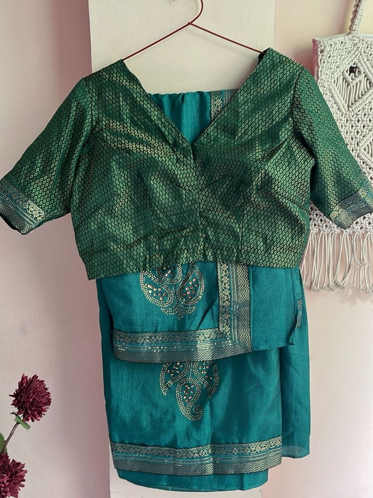 Elegant Teal Saree with Embellished Blouse