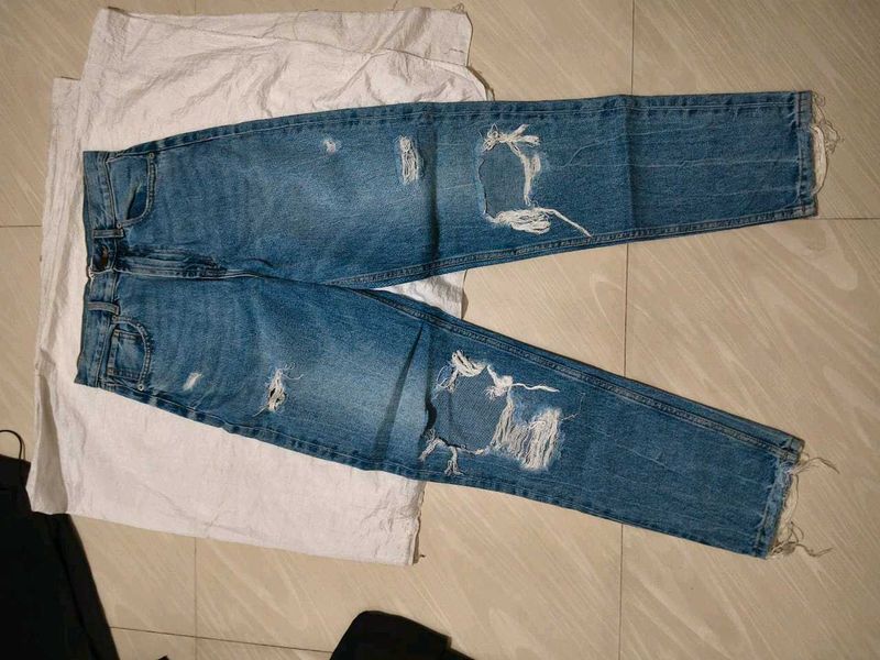 Distressed Blue Denim Jeans