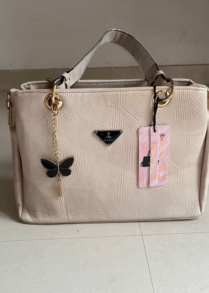 Stylish Beige Textured Handbag with Butterfly Char
