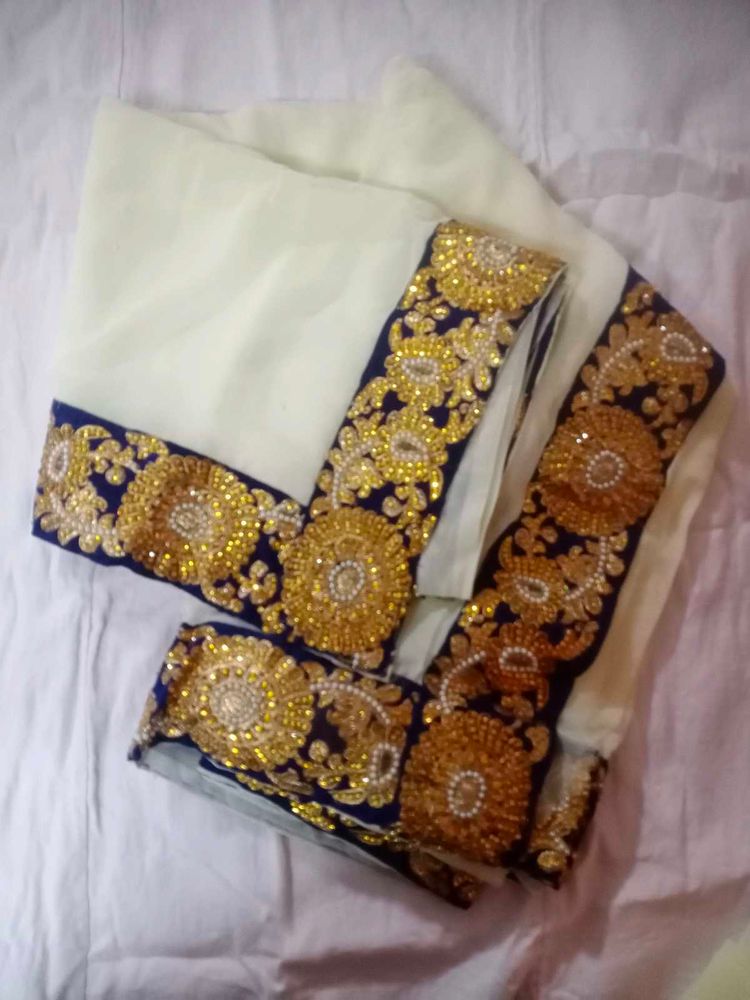 Elegant Cream Saree with Gold Embroidery