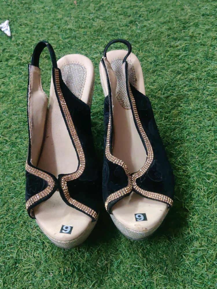 Black And Golden Heels