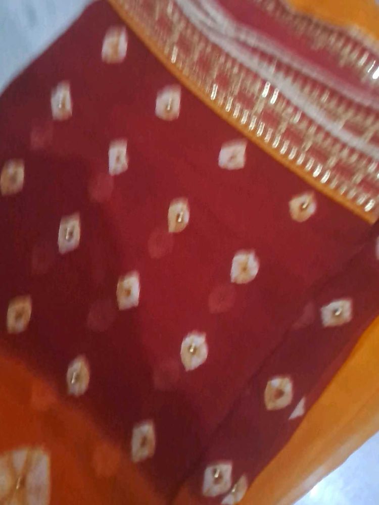 used Beautiful Maroon  orange Bandhani Saree