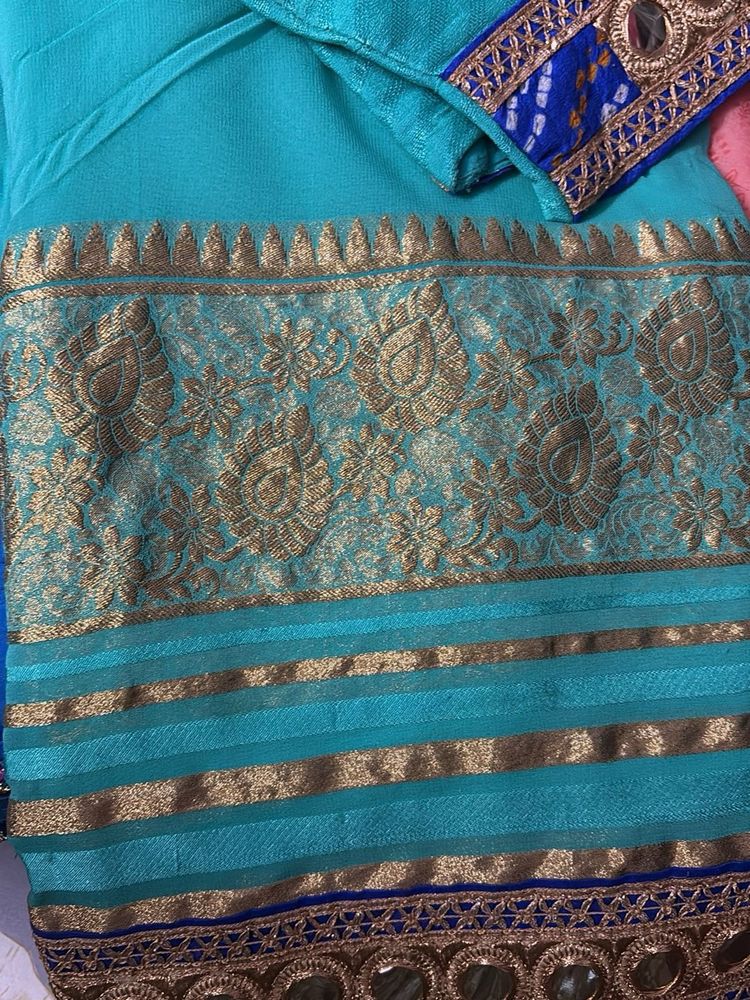 Stunning Teal Saree with Gold Border