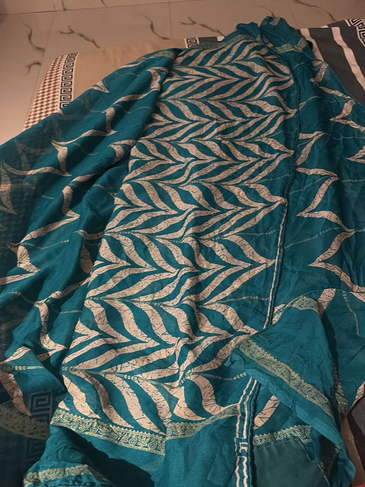 Teal saree with leaf design