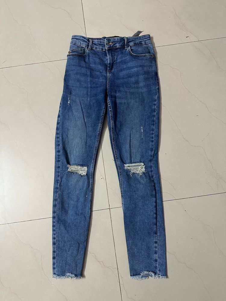 Ripped Knee Denim Jeans