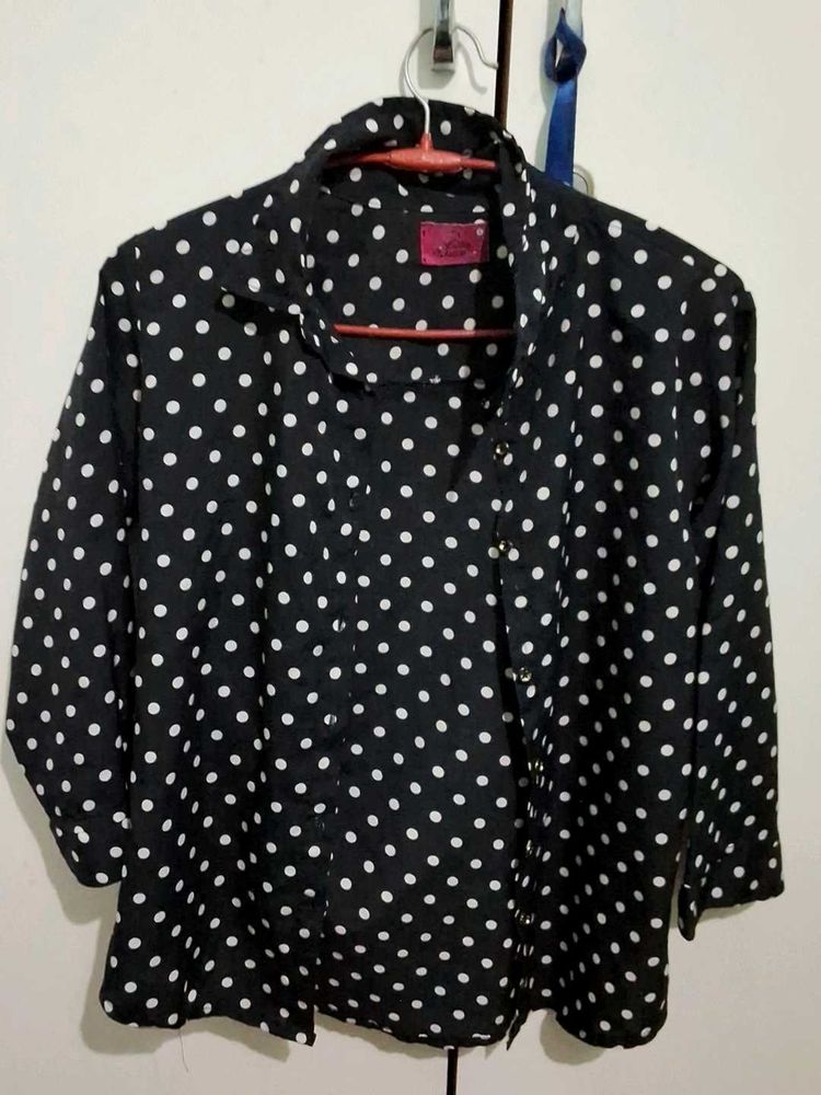 black polka dot shirt
