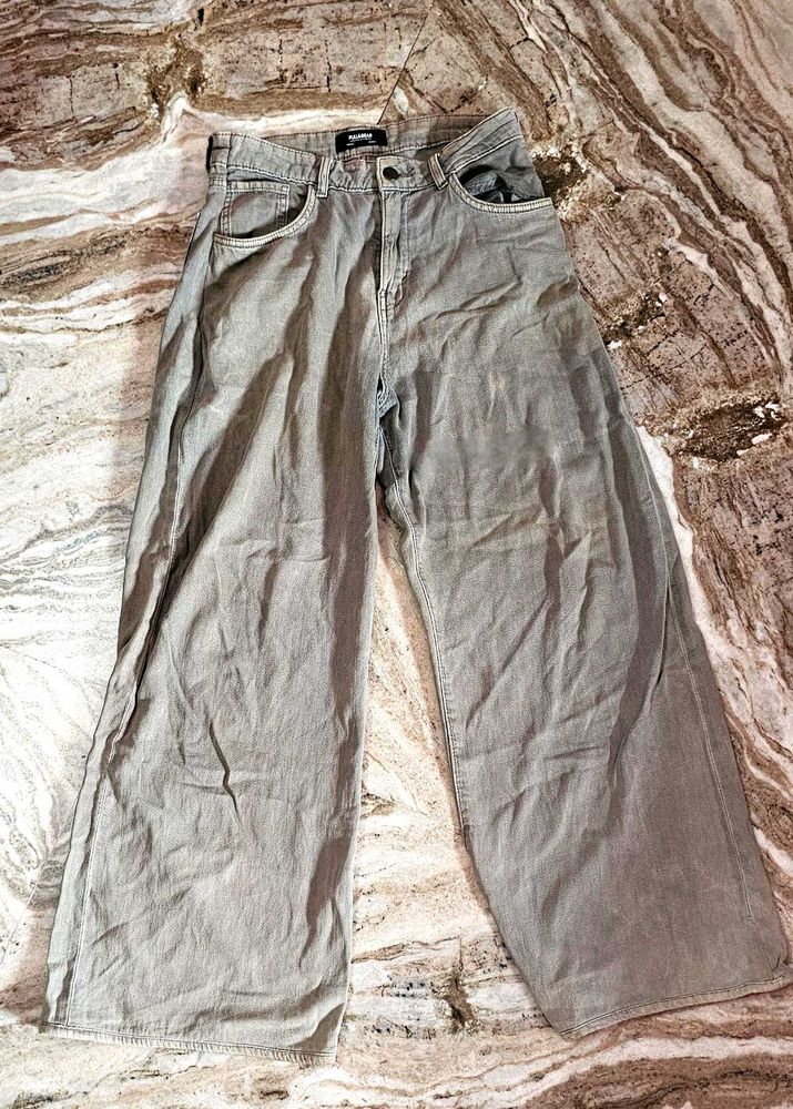 gray boot cut trouser, used. colour faded.