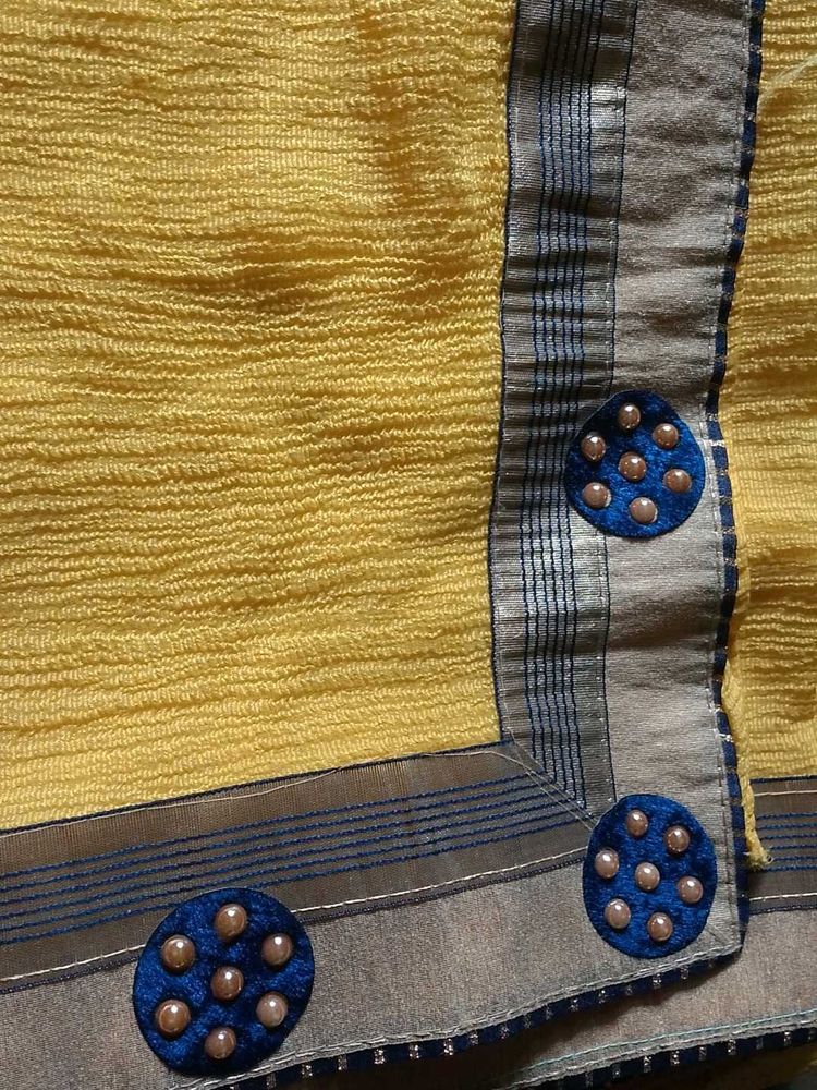 Vibrant Yellow Saree with Blue Embellishments