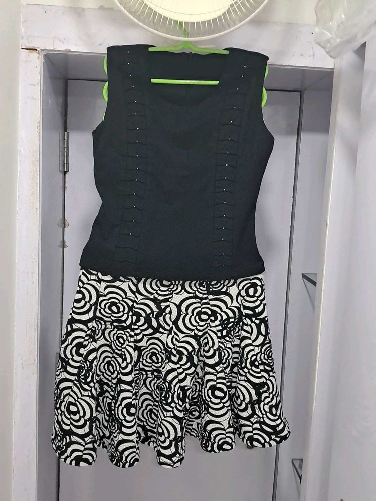 Black Sleeveless Top with Floral Skirt
