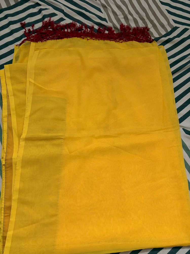 Bright Yellow saree with Red Tassels