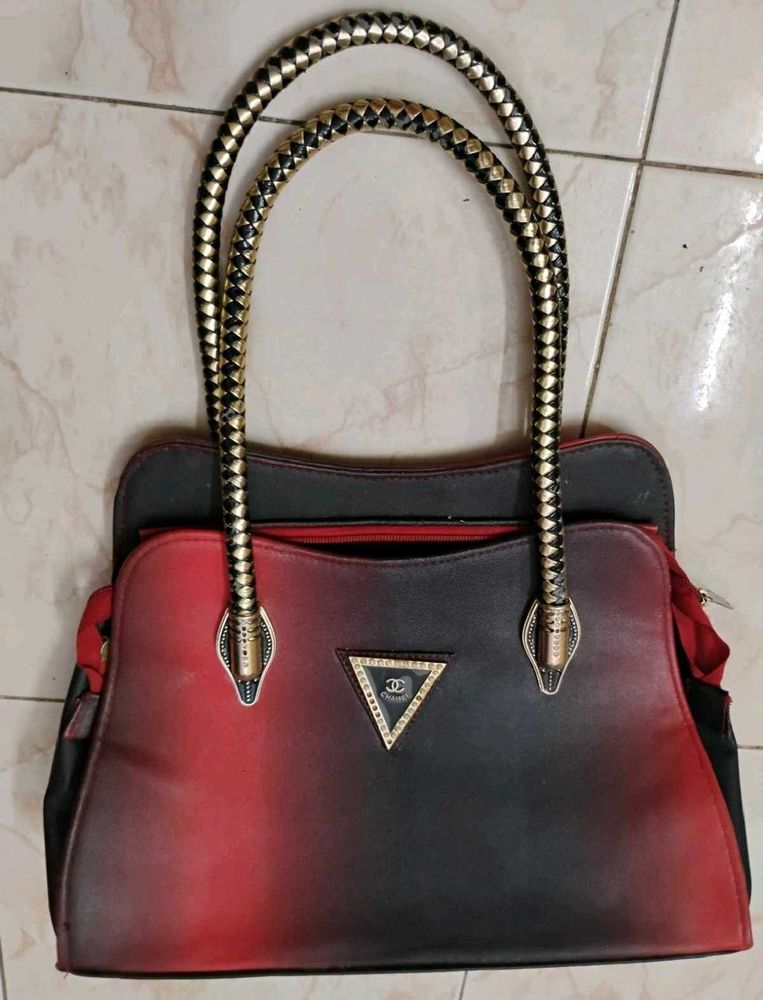 Stylish Handbag with Snake Handle Design