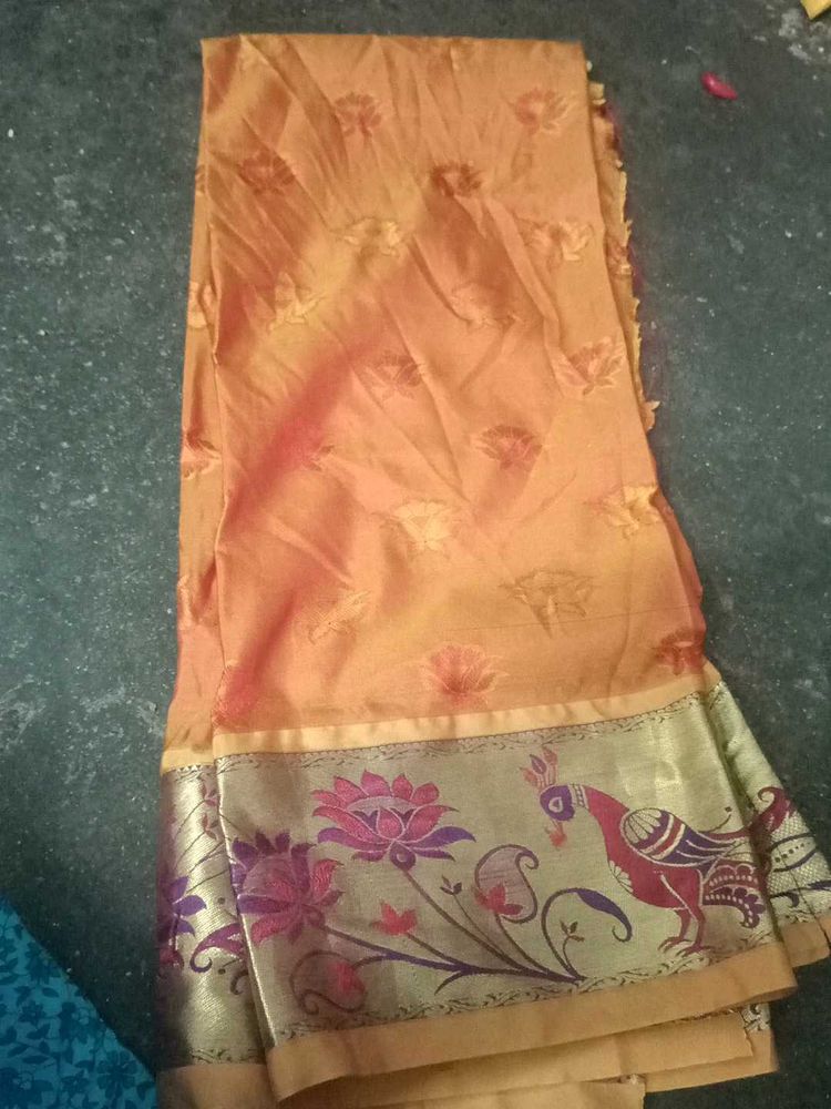 Orange blouse material with Peacock Border