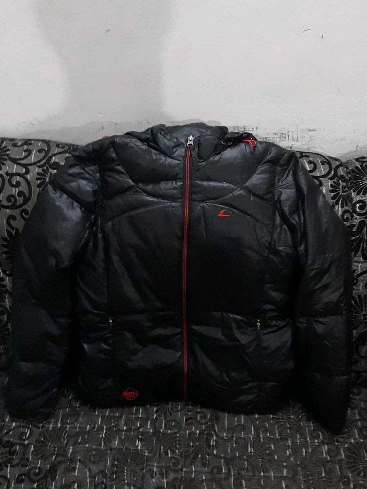 Black Puffer Jacket with Red Accents