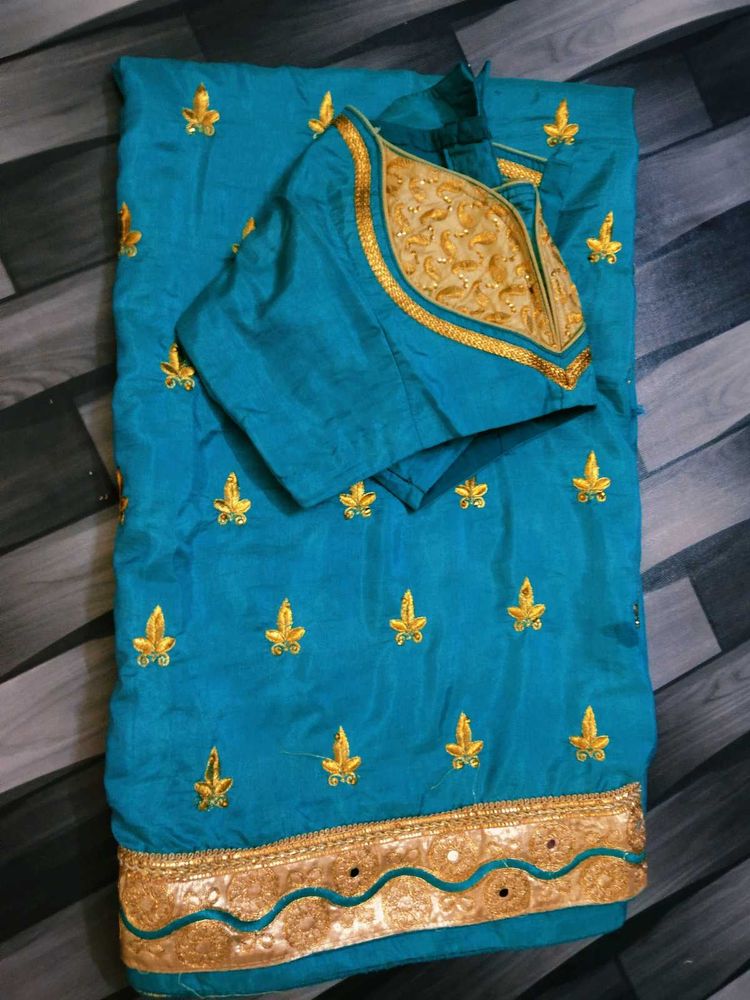 Beautiful Teal Saree with Gold Embroidery