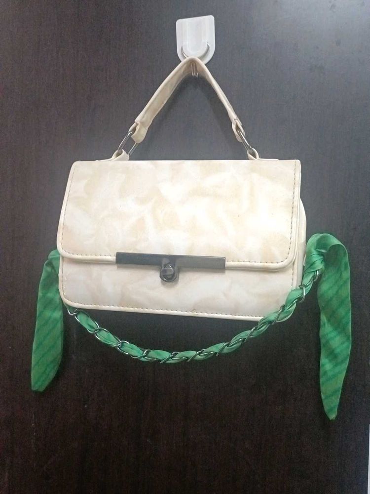 Chic Cream Textured Handbag with Green Scarf Accen