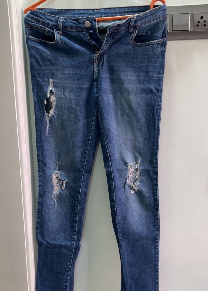 Distressed Blue Denim Jeans