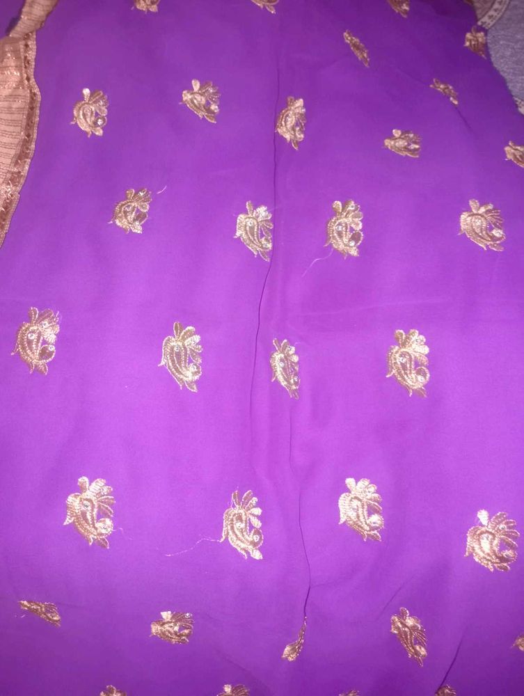 Vibrant Purple Saree with Gold Embellishments
