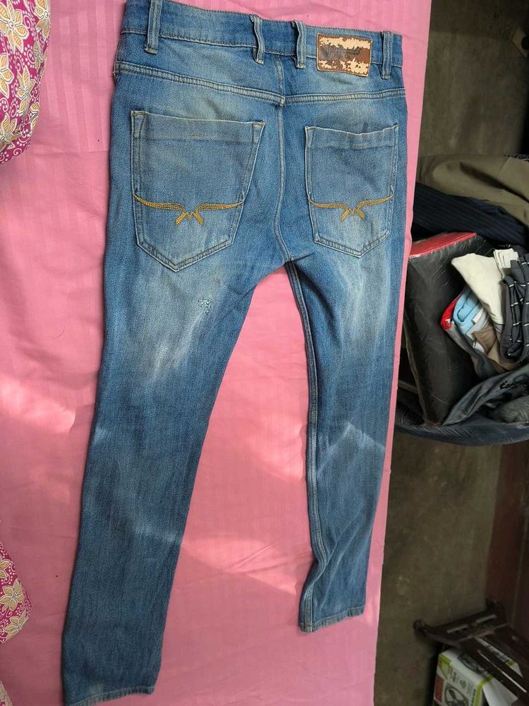 Distressed Denim Jeans