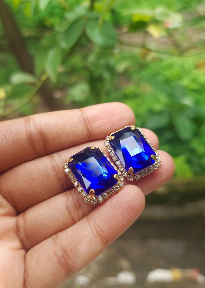 Classic Sapphire Earrings With Diamonds Around It
