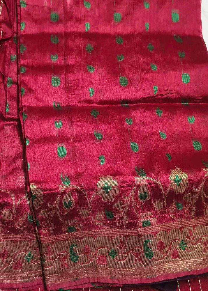 Elegant Red Saree with Green Motifs