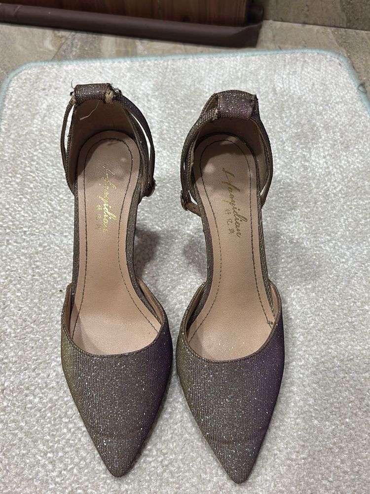 shiny pair of stelletoes
