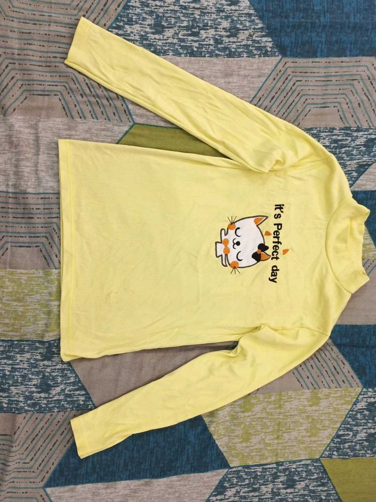 high neck pastel yellow top with embroiderd cat