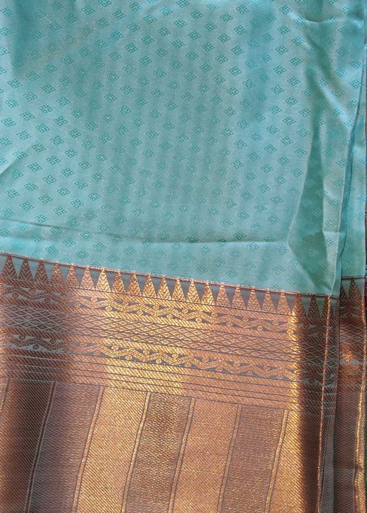 Elegant Turquoise Saree with Gold Border
