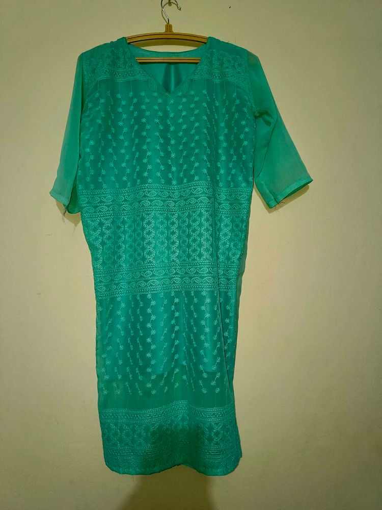 Elegant Teal Saree with Intricate Border