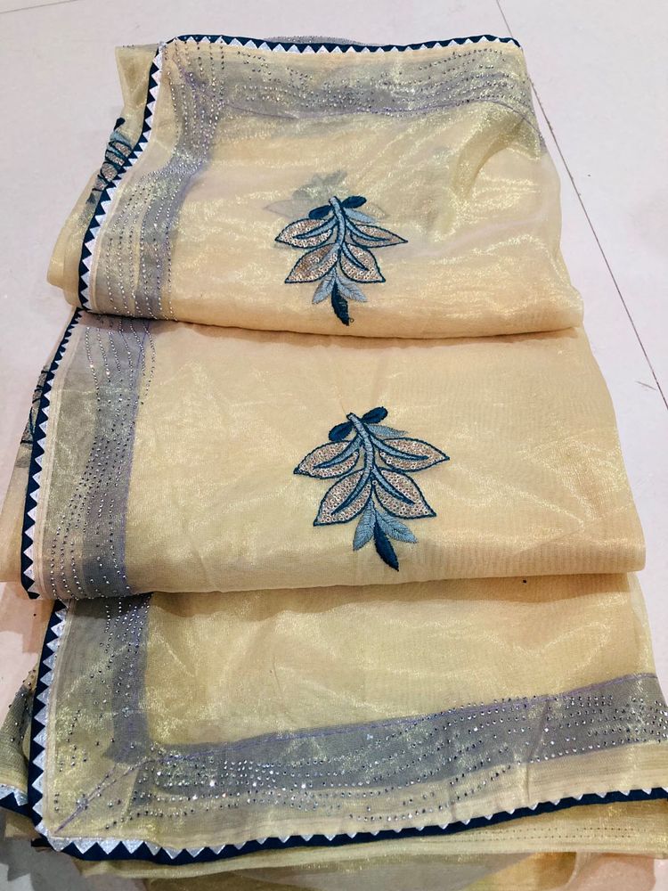Elegant Embroidered Cream Saree