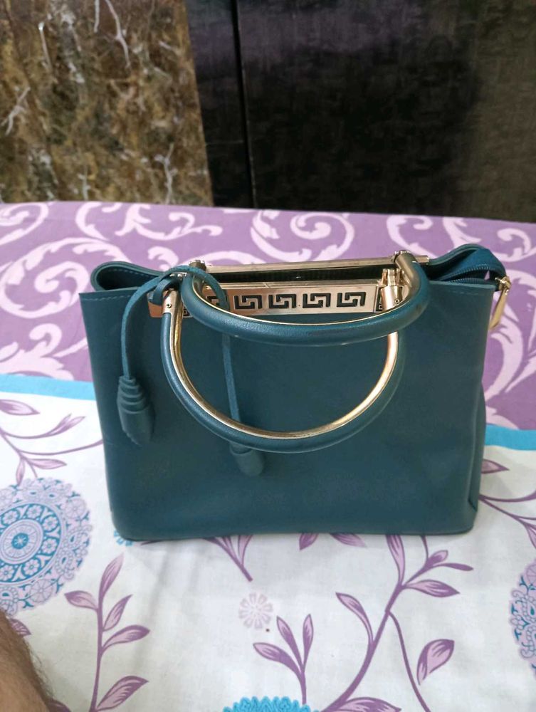 Stylish Teal Handbag with Gold Accents