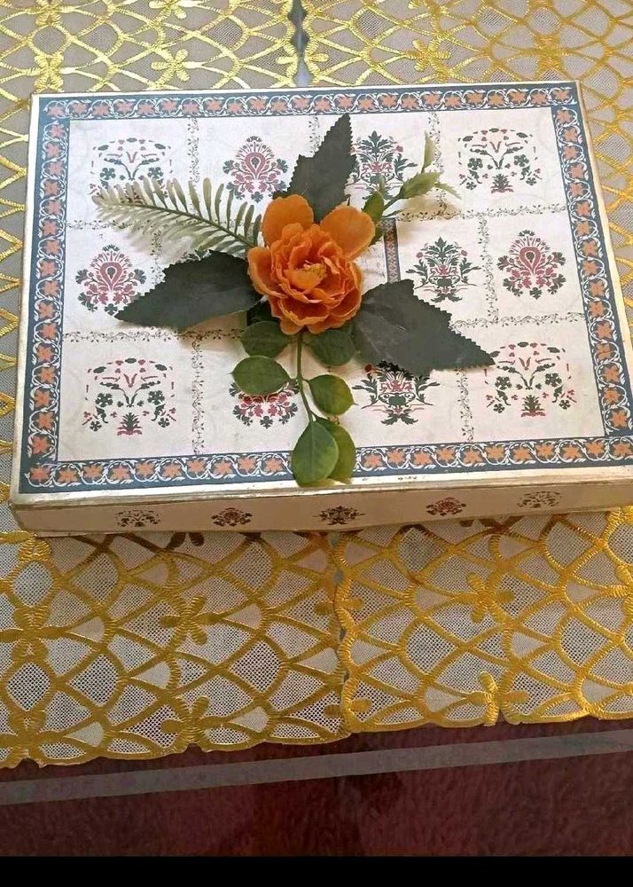 13. Decorative Gift Box with Floral Accent
