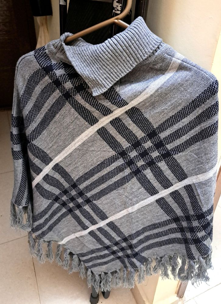 Beautiful Knit Poncho With Pattern Detailing