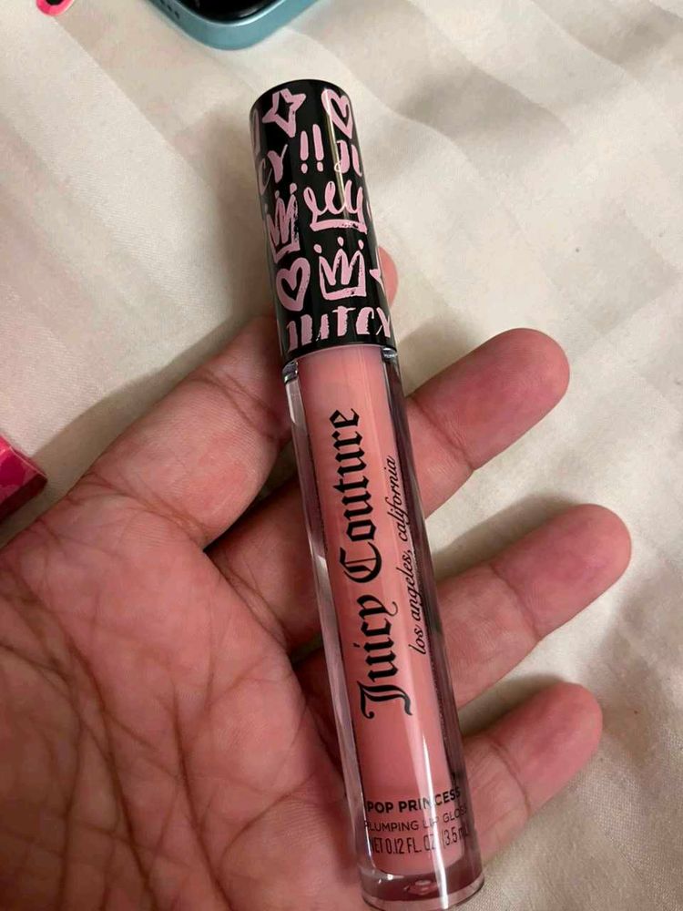 Juicy Couture plumping Lip Gloss