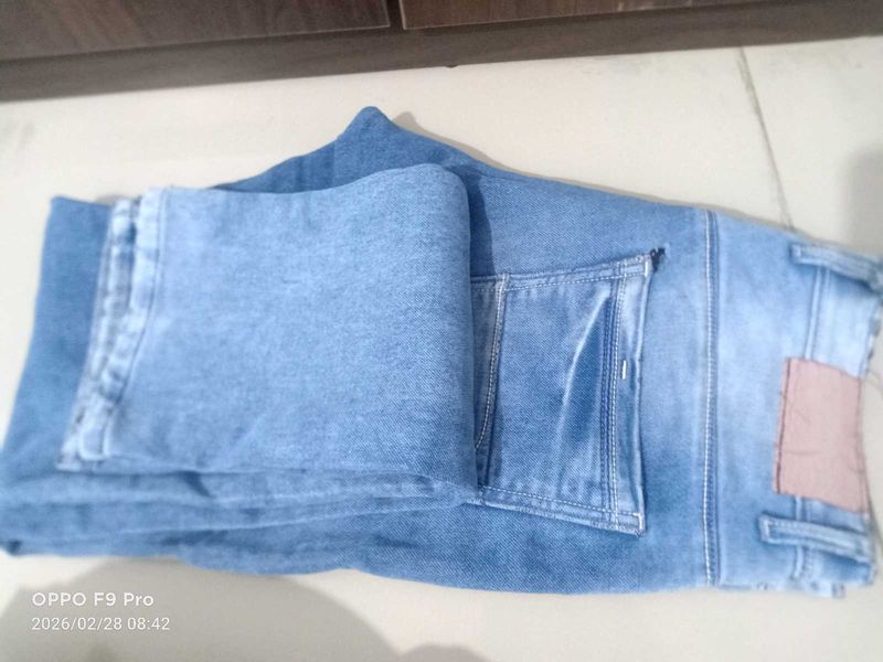 Stylish Light Wash Denim Jeans with Unique Patch D