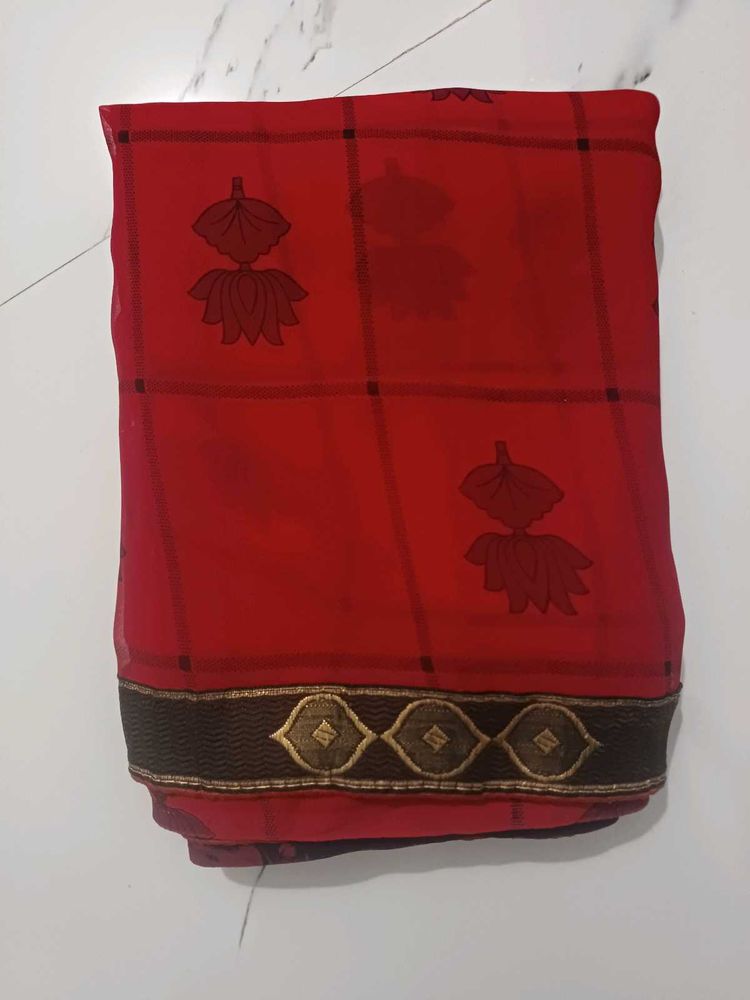 Elegant Red Saree with Lotus Motifs