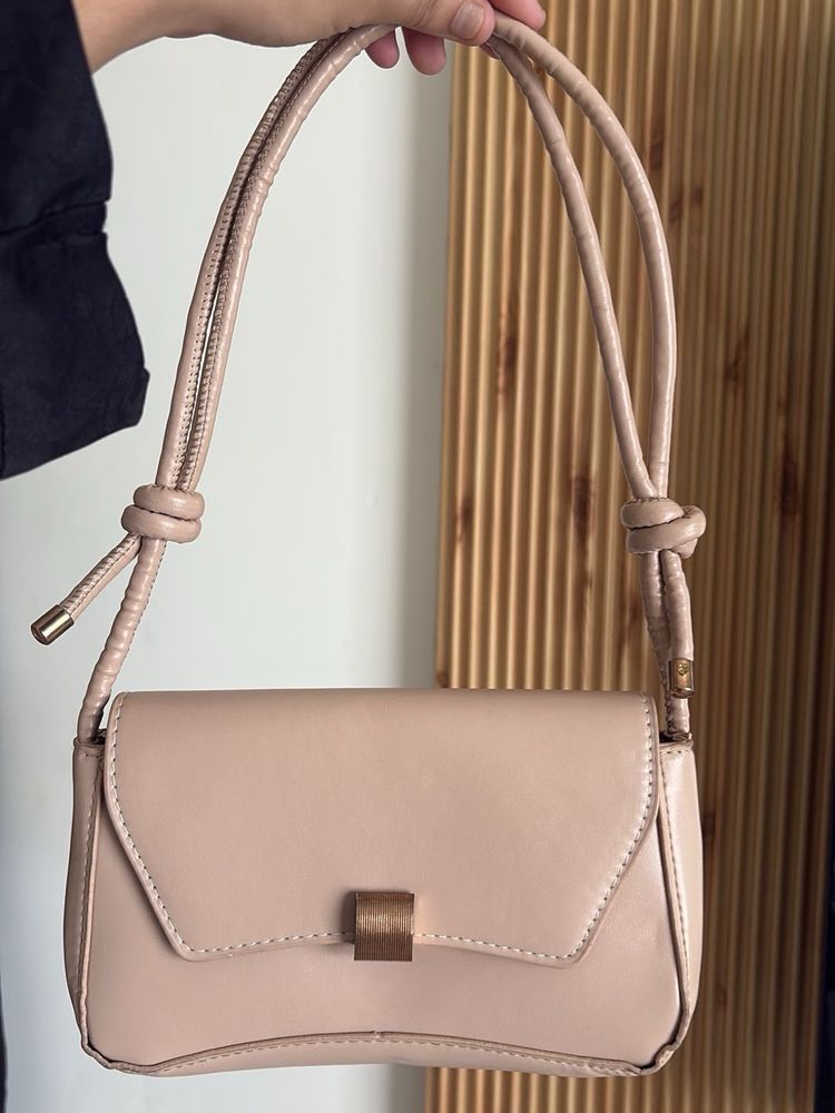 chic nude color side bag with golden buckle