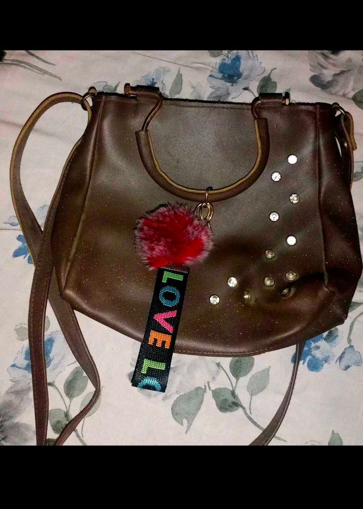 Stylish Brown Handbag with Charm