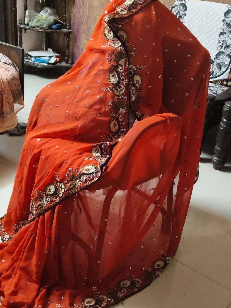 Elegant Orange Embroidered Saree