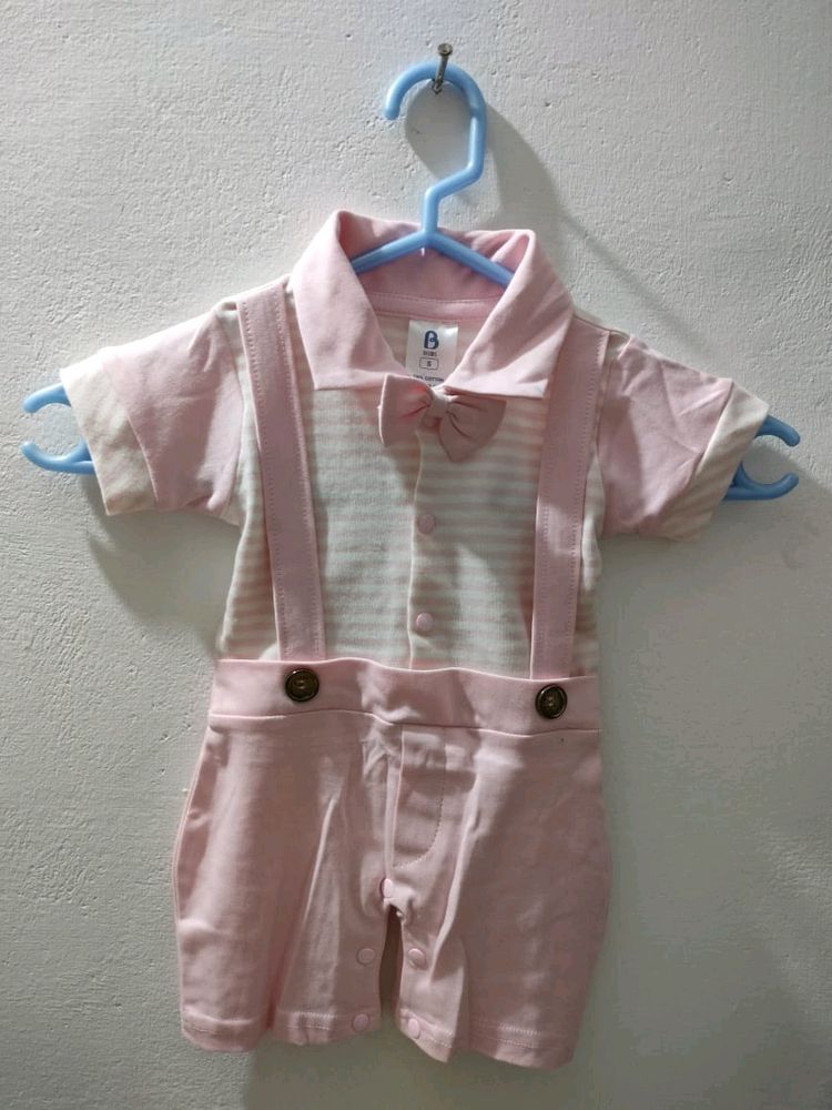 BKIDS small size boy's dress look like romper in pink and white color combination.