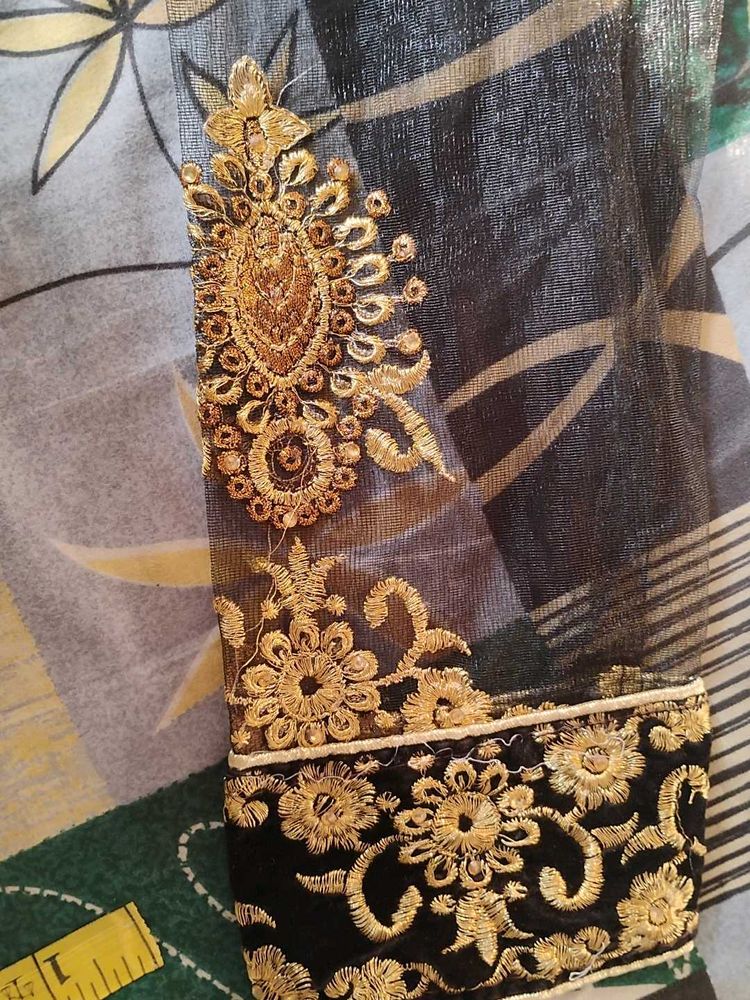 Elegant Black Blouse with Golden Embellishments