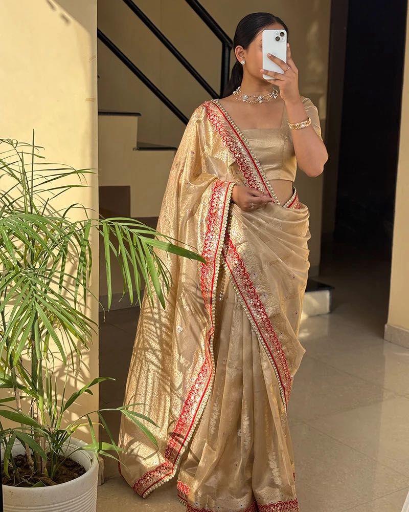 Elegant Golden Saree with Red Border