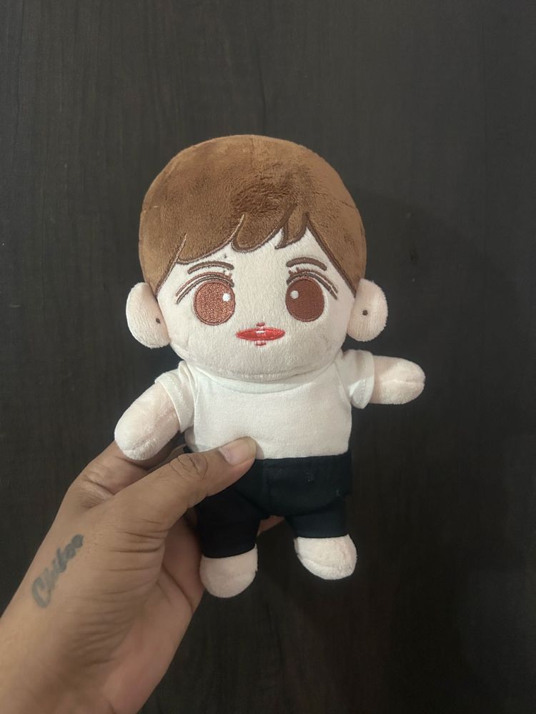 small cotton plush doll dressed in a casual white