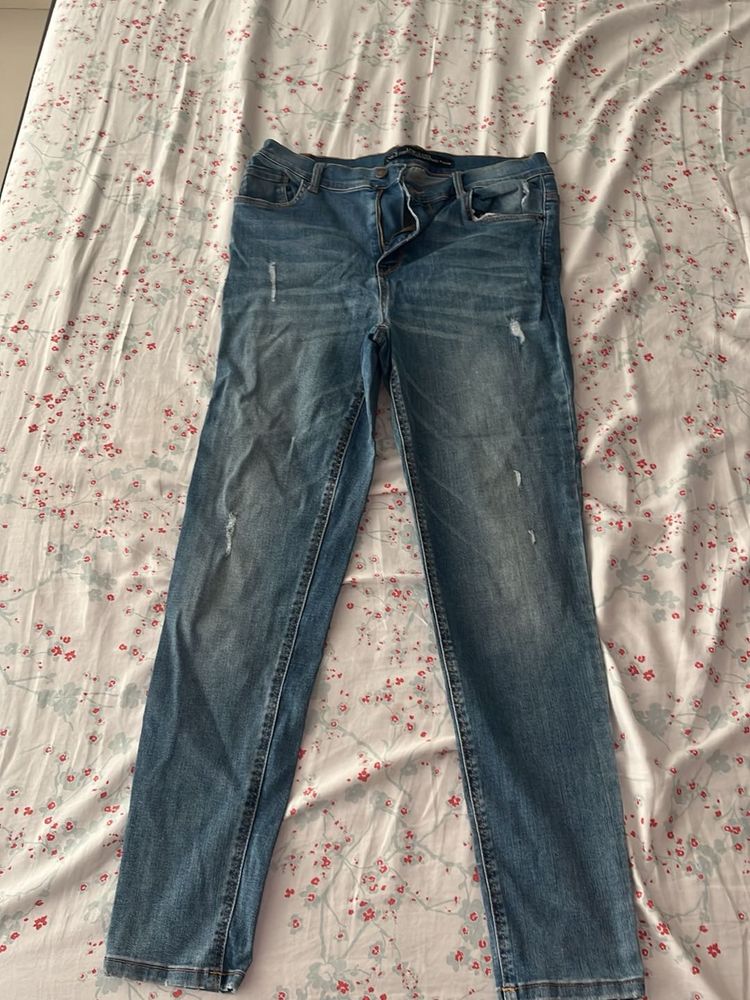 Distressed Blue Denim Jeans